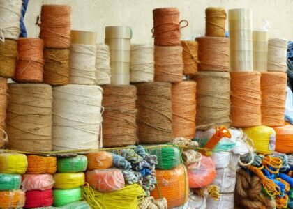 a bunch of different colored twine on display