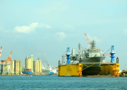 A large yellow and black boat in the water