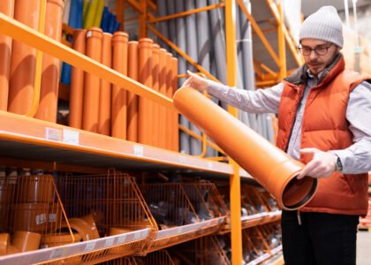 male customer plumbing store chooses sewer pipes his house